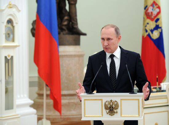 President Vladimir Putin presents state decorations to Russian servicemen