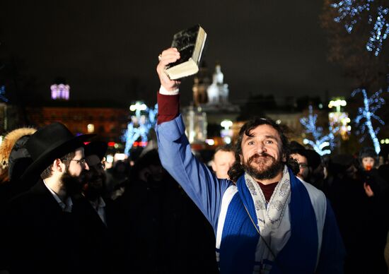 Lighting Hanukkah candles on Revolution Square in Moscow