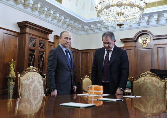 President Vladimir Putin meets with Defense Minister Sergei Shoigu