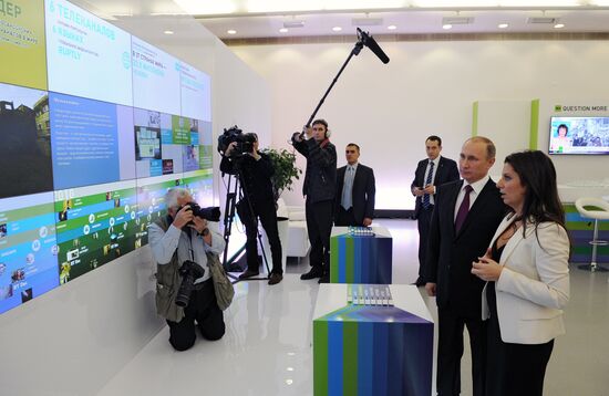 Vladimir Putin visits exhibition marking Russia Today news channel's 10th anniversary