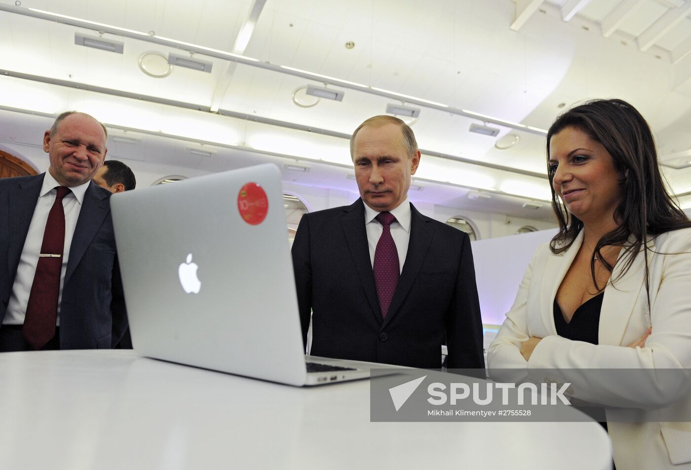 Vladimir Putin visits exhibition marking Russia Today news channel's 10th anniversary