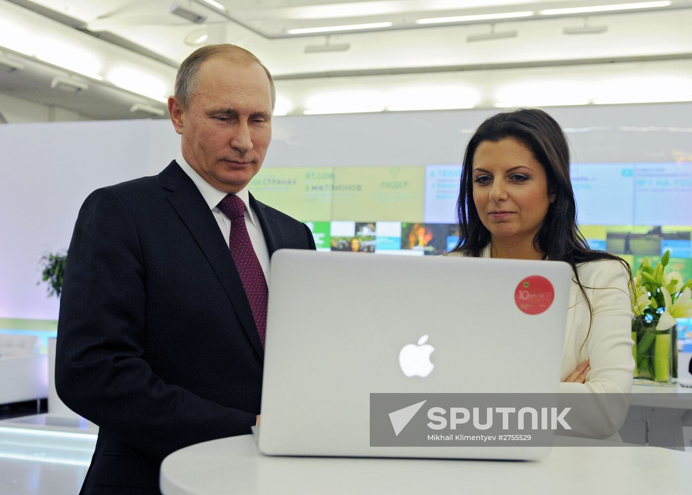 Vladimir Putin visits exhibition marking Russia Today news channel's 10th anniversary