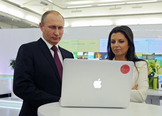 Vladimir Putin visits exhibition marking Russia Today news channel's 10th anniversary