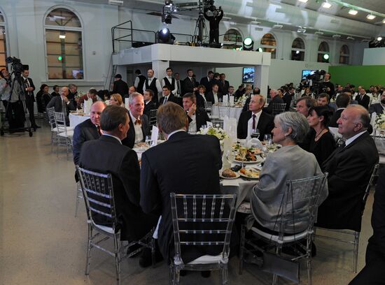 Vladimir Putin visits exhibition marking Russia Today news channel's 10th anniversary