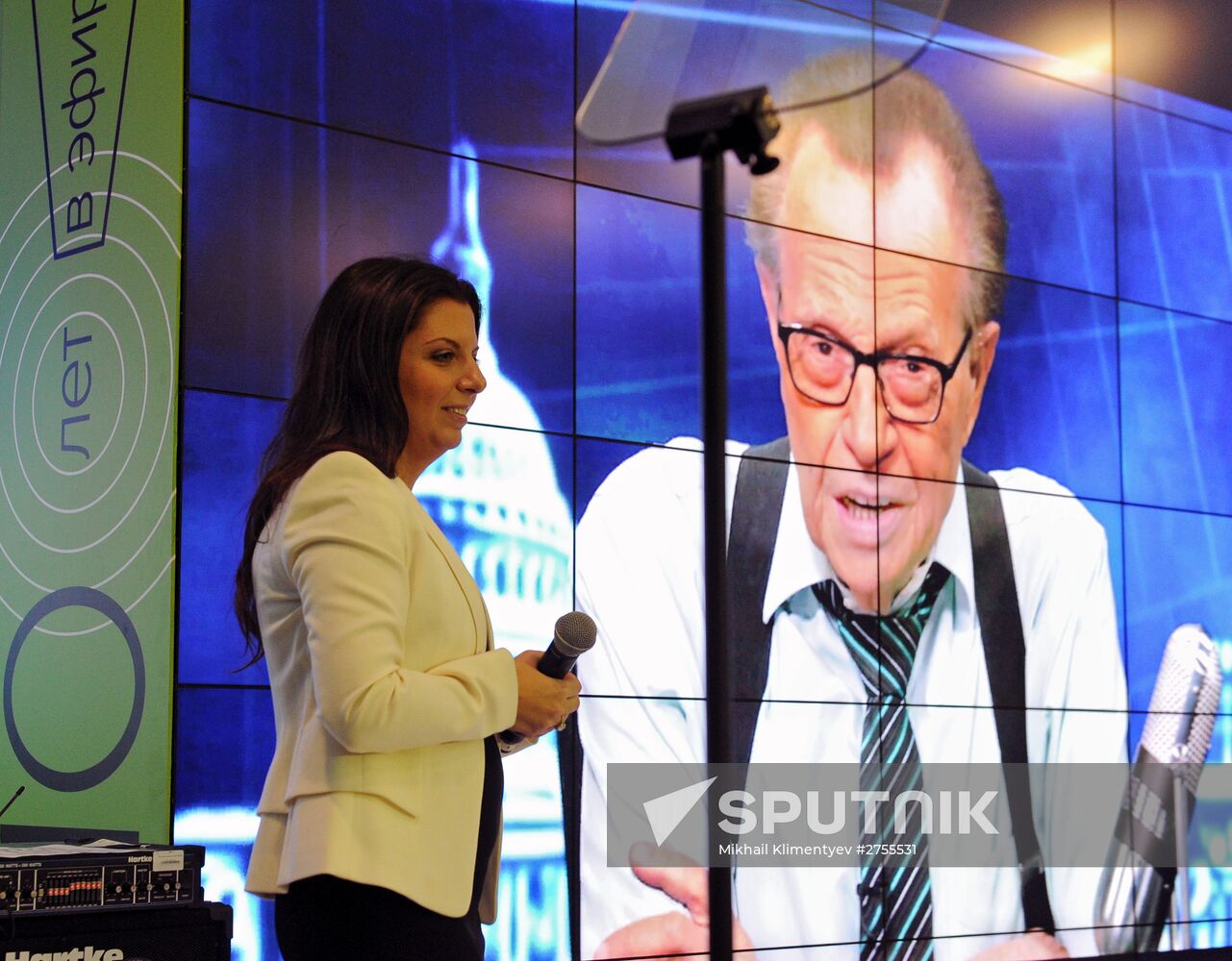 Vladimir Putin visits exhibition marking Russia Today news channel's 10th anniversary