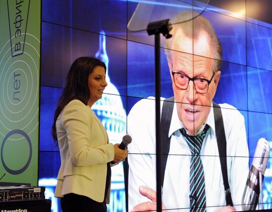 Vladimir Putin visits exhibition marking Russia Today news channel's 10th anniversary