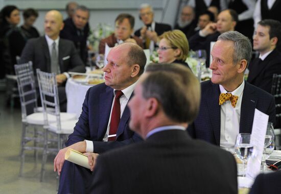 Vladimir Putin visits exhibition marking Russia Today news channel's 10th anniversary