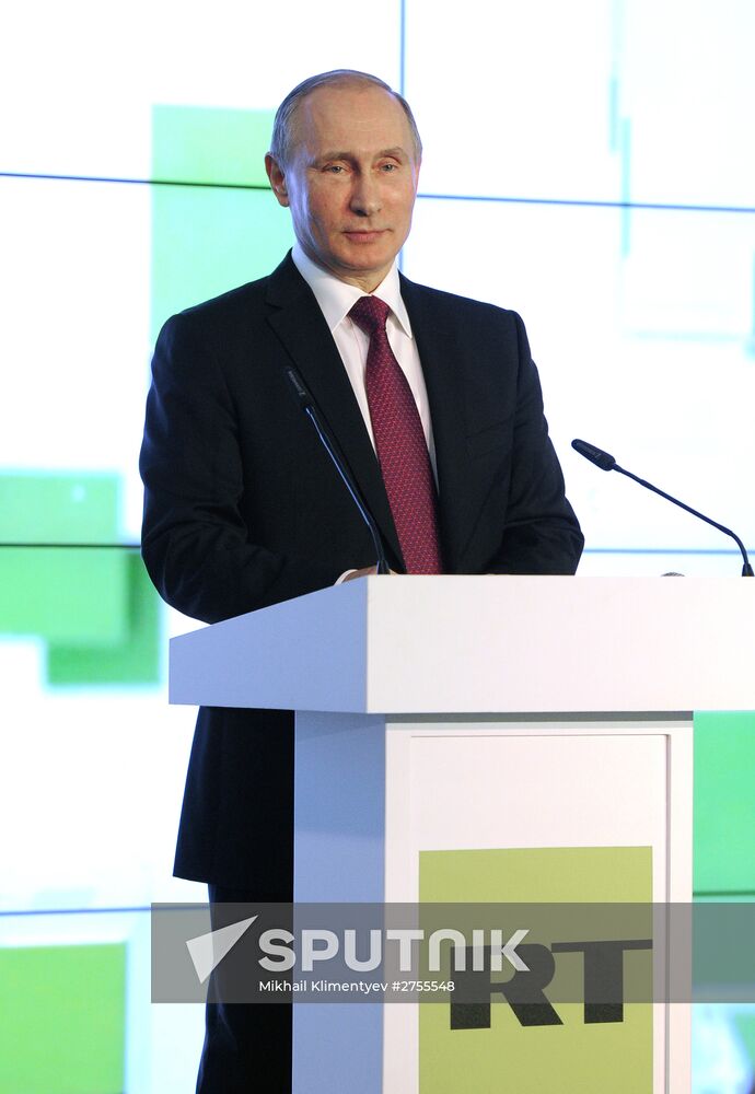 Vladimir Putin visits exhibition marking Russia Today news channel's 10th anniversary