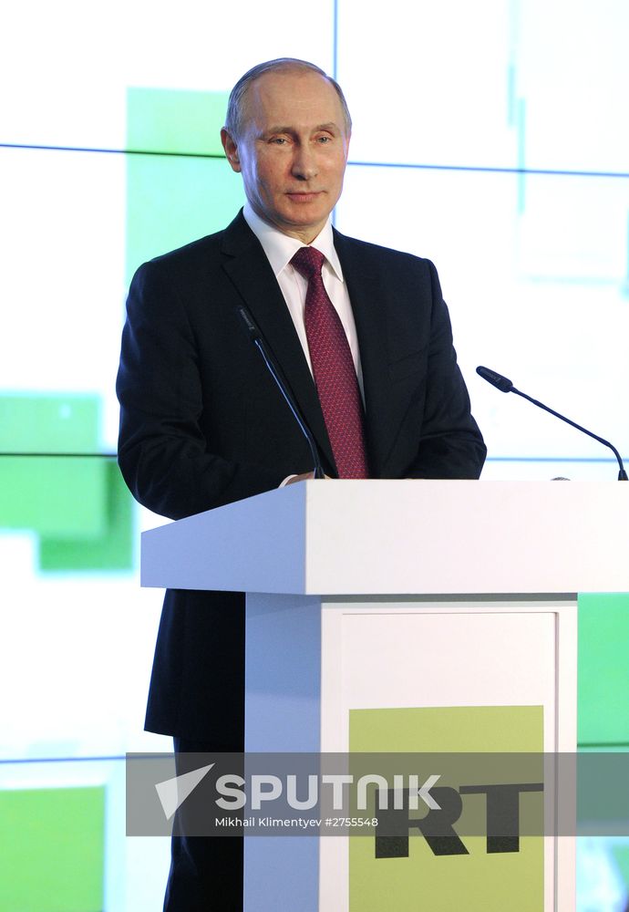 Vladimir Putin visits exhibition marking Russia Today news channel's 10th anniversary