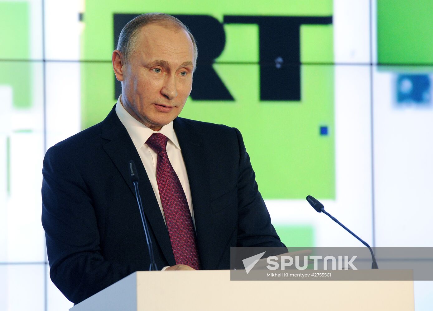 Vladimir Putin visits exhibition marking Russia Today news channel's 10th anniversary