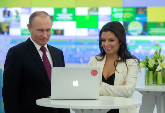 Vladimir Putin visits exhibition marking Russia Today news channel's 10th anniversary