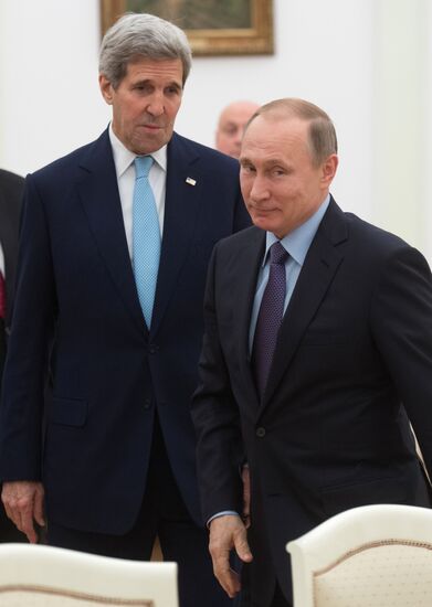 President Vladimir Putin meets with US Secretary of State John Kerry