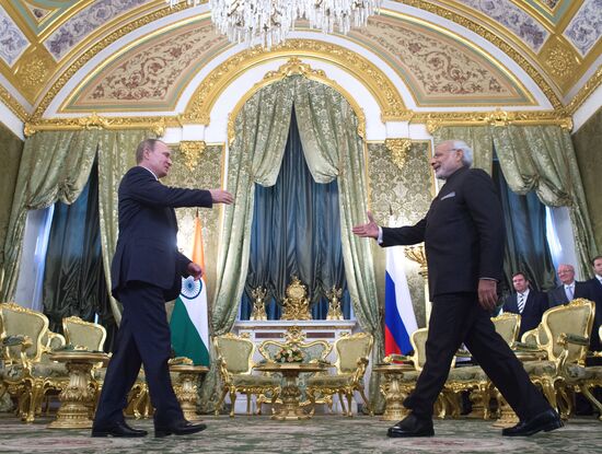 Russian President Vladimir Putin meets with Indian Prime Minister Narendra Modi