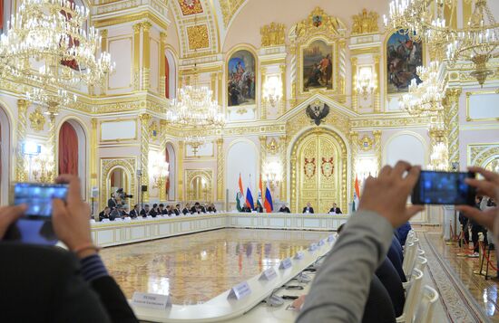 Russian President Vladimir Putin meets with Indian Prime Minister Narendra Modi
