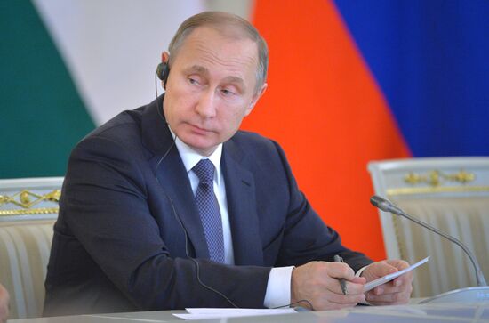 Russian President Vladimir Putin meets with Indian Prime Minister Narendra Modi