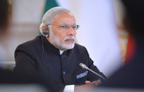 Russian President Vladimir Putin meets with Indian Prime Minister Narendra Modi