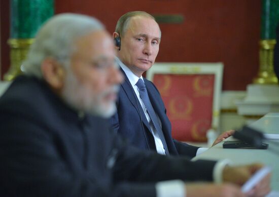 Russian President Vladimir Putin meets with Indian Prime Minister Narendra Modi