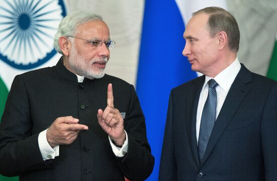 Russian President Vladimir Putin meets with Indian Prime Minister Narendra Modi