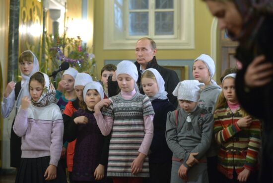 President Vladimir Putin attends a Christmas service