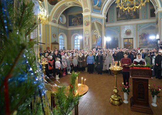 President Vladimir Putin attends a Christmas service