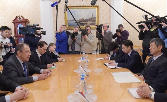 Russian Foreign Minister Sergey Lavrov meets with former Japanese Foreign Minister Masahiko Komura in Moscow.
