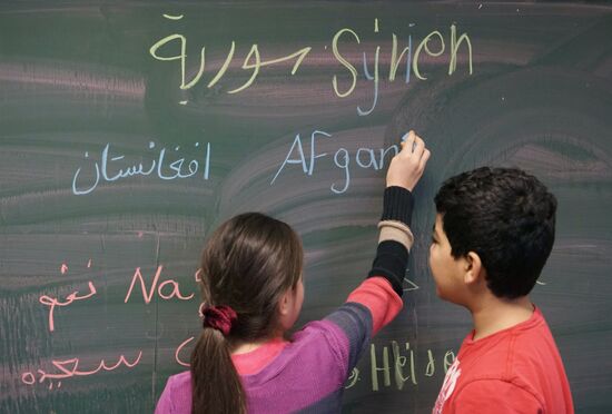 Children of refugees from Syria, Afghanistan in class in German school