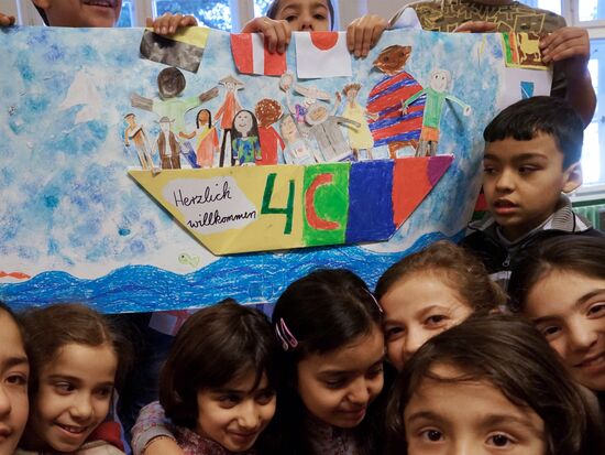 Children of refugees from Syria, Afghanistan in class in German school