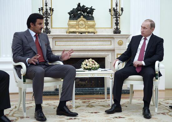 President Vladimir Putin meets with Qatar Emir Tamim bin Hamad Al-Thani