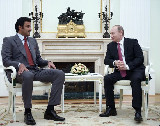 President Vladimir Putin meets with Qatar Emir Tamim bin Hamad Al-Thani