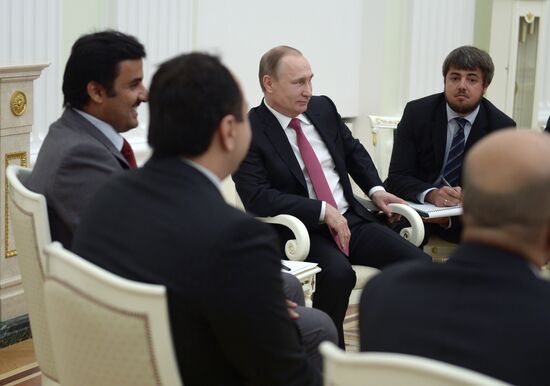 President Vladimir Putin meets with Qatar Emir Tamim bin Hamad Al-Thani