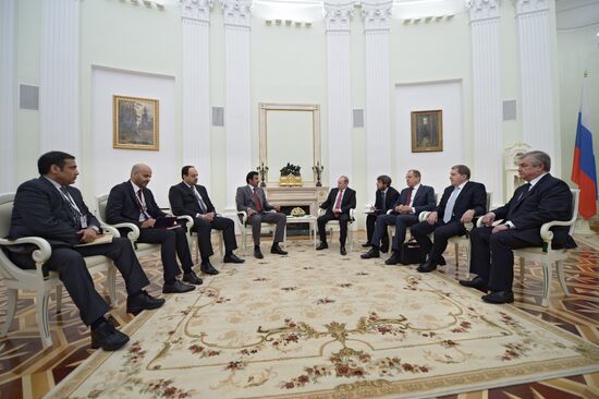 President Vladimir Putin meets with Qatari Emir Tamim bin Hamad Al-Thani