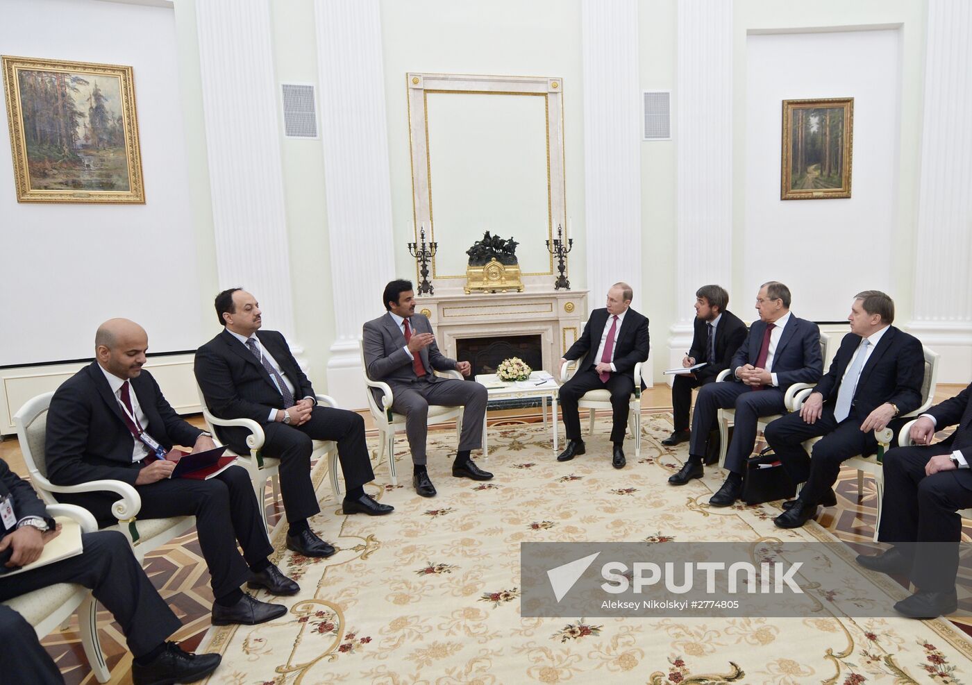 President Vladimir Putin meets with Qatar Emir Tamim bin Hamad Al-Thani