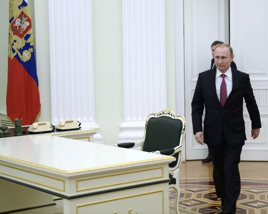 President Vladimir Putin meets with Qatar Emir Tamim bin Hamad Al-Thani