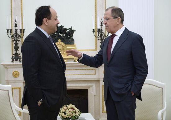 President Vladimir Putin meets with Qatari Emir Tamim bin Hamad Al-Thani