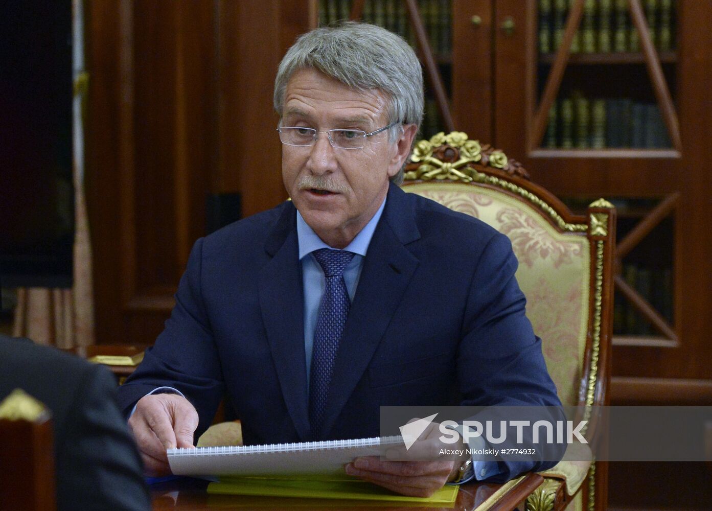 Russian President Vladimir Putin meets with CEO of Novatek gas company Leonid Mikhelson
