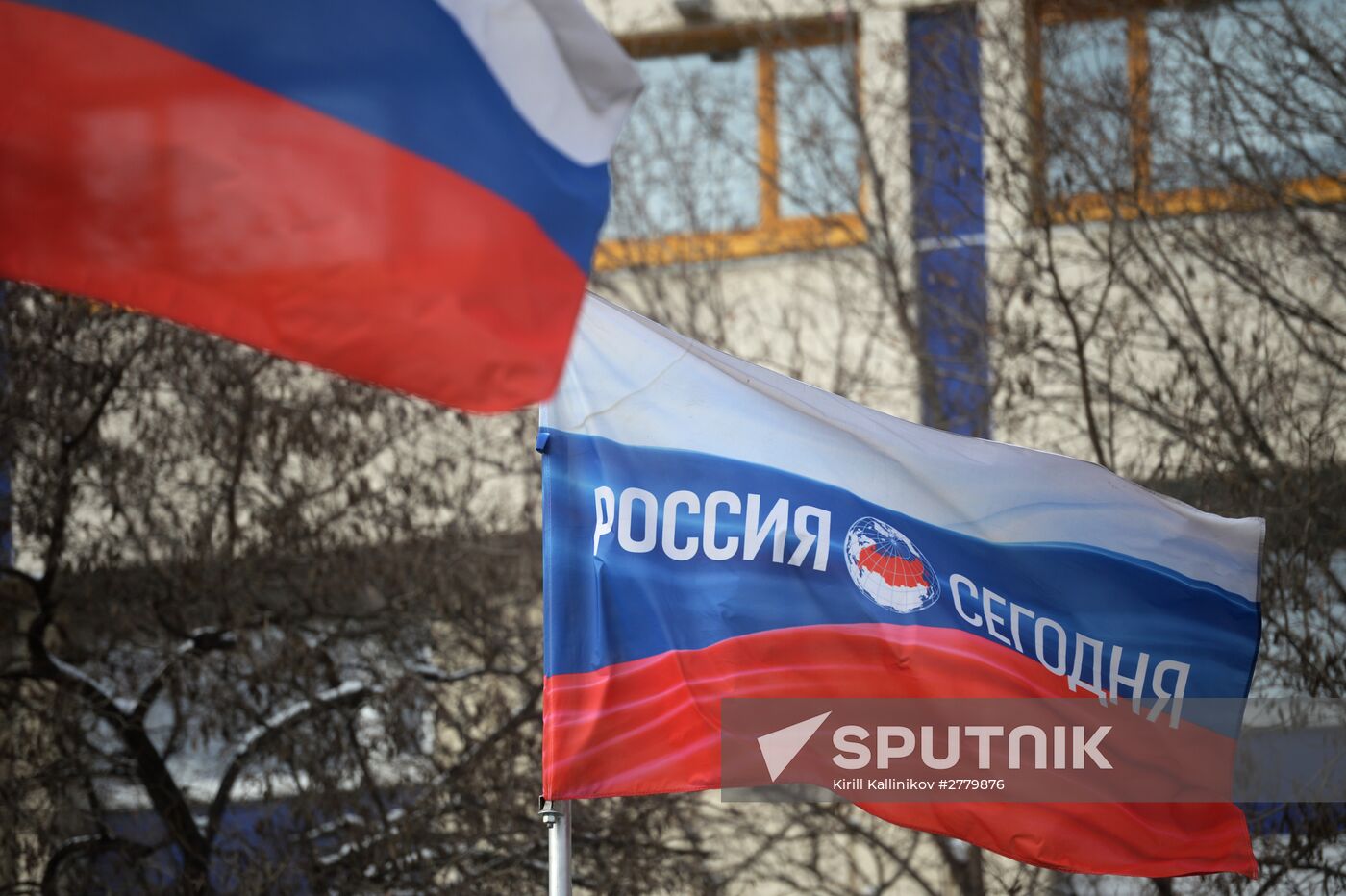 Russian flag with logotype of International information agency "Rossiya Segodnya"