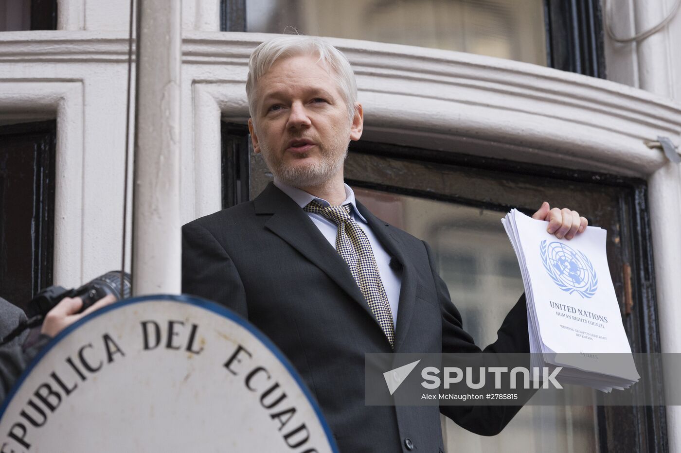 Julian Assange addresses journalists and protesters from Ecuadoran Embassy in London
