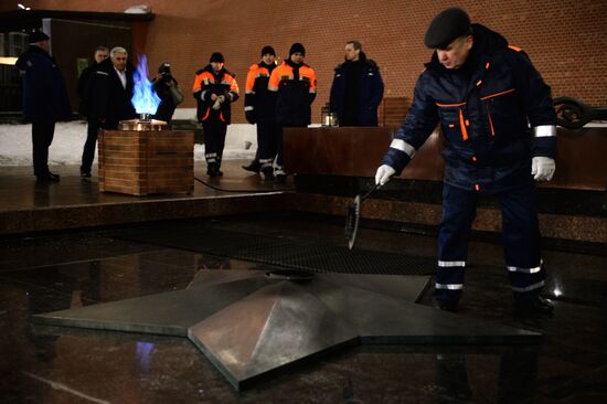 Checking burner of Eternal Flame before Defender of Fatherland Day