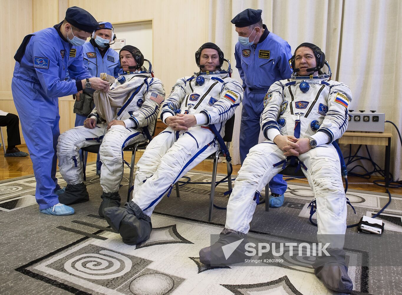 ISS 47/48 prime crew try on space suits, inspect spacecraft