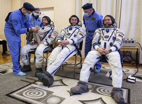 ISS 47/48 prime crew try on space suits, inspect spacecraft