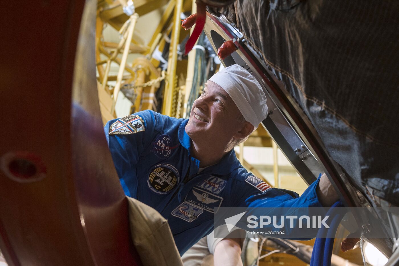 ISS 47/48 prime crew try on space suits, inspect spacecraft
