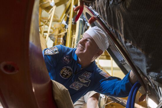 ISS 47/48 prime crew try on space suits, inspect spacecraft