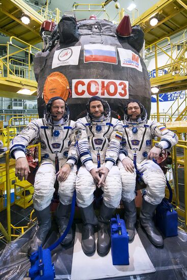 ISS 47/48 prime crew try on space suits, inspect spacecraft