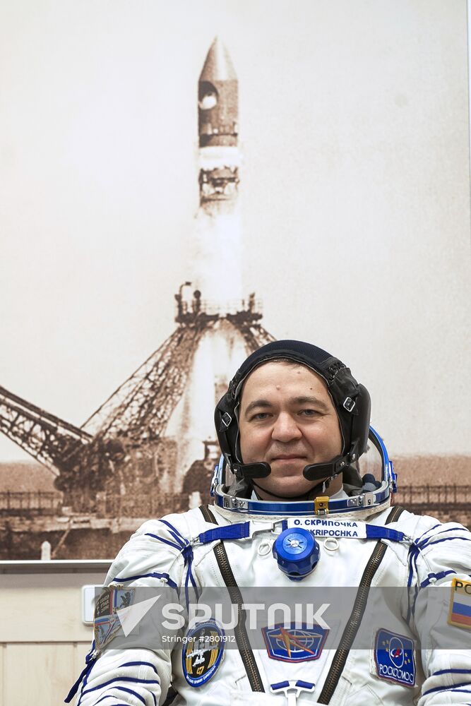 ISS 47/48 prime crew try on space suits, inspect spacecraft