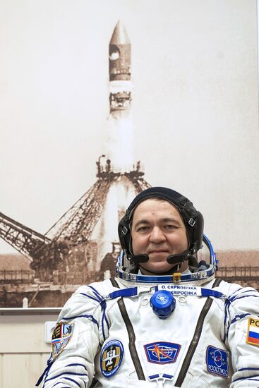 ISS 47/48 prime crew try on space suits, inspect spacecraft