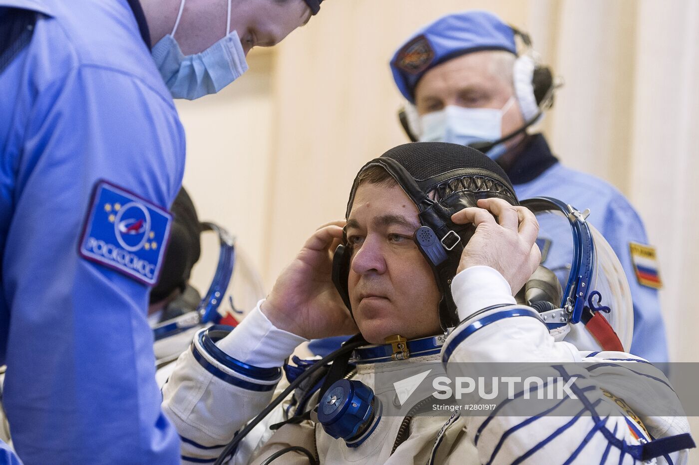 ISS 47/48 prime crew try on space suits, inspect spacecraft
