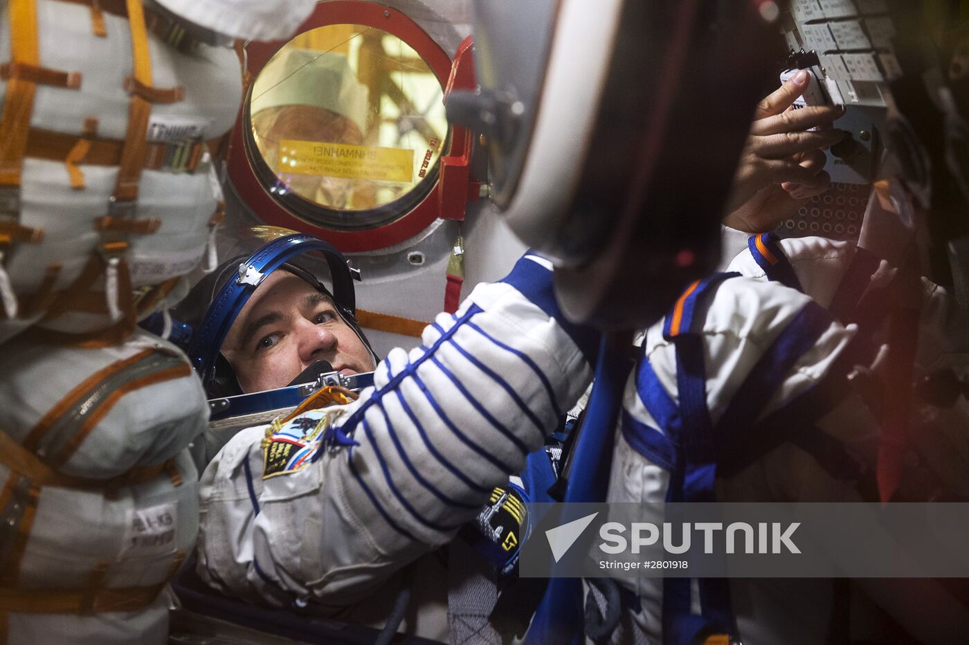 ISS 47/48 prime crew try on space suits, inspect spacecraft