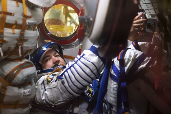 ISS 47/48 prime crew try on space suits, inspect spacecraft