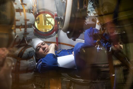 ISS 47/48 prime crew try on space suits, inspect spacecraft