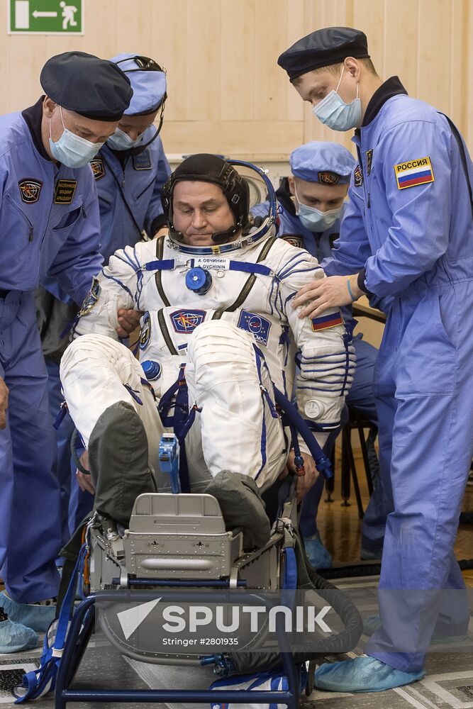ISS 47/48 prime crew try on space suits, inspect spacecraft
